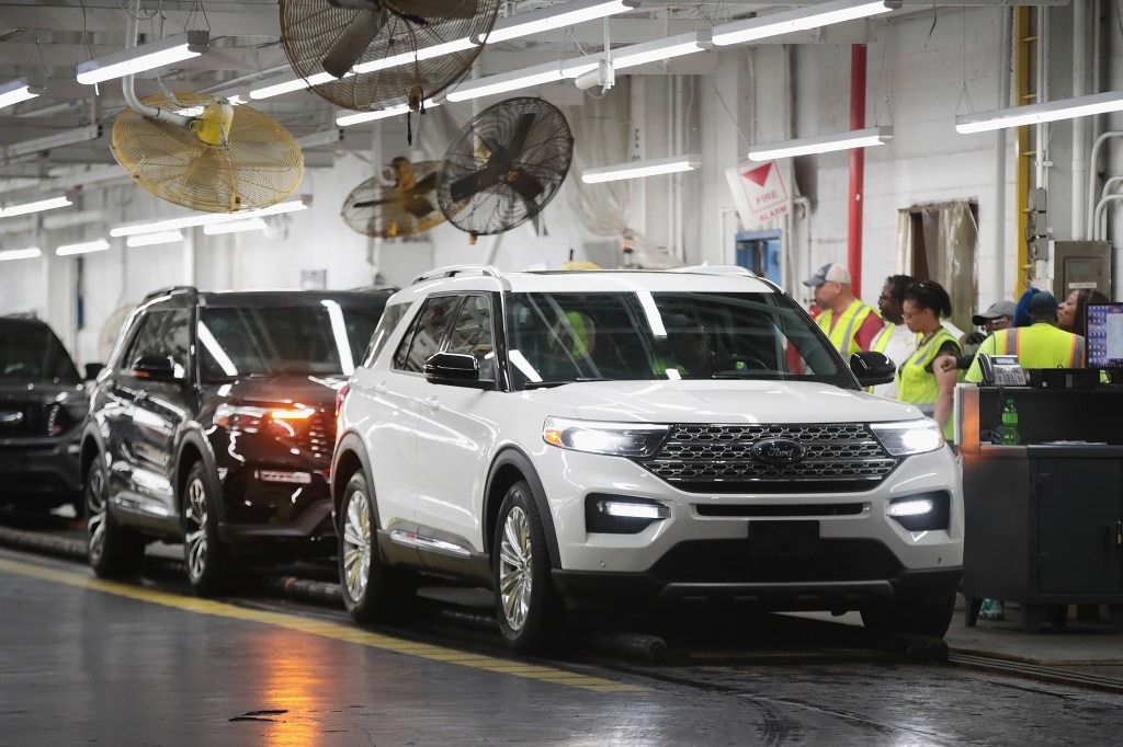 Ford Explorers being assembled in a plant