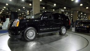 A GMC Yukon Hybrid on display at an auto show