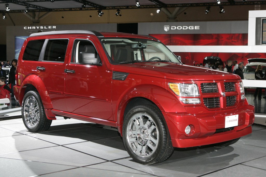 A red 2007 Dodge Nitro sits on display indoors.