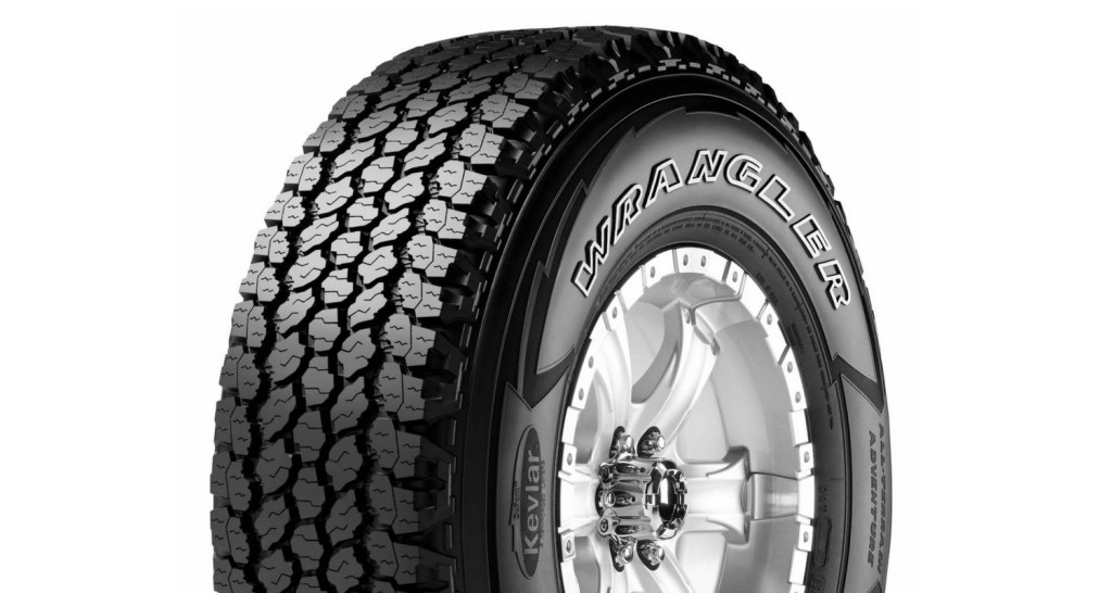 A single Goodyear Wrangler tire with outlined white letters