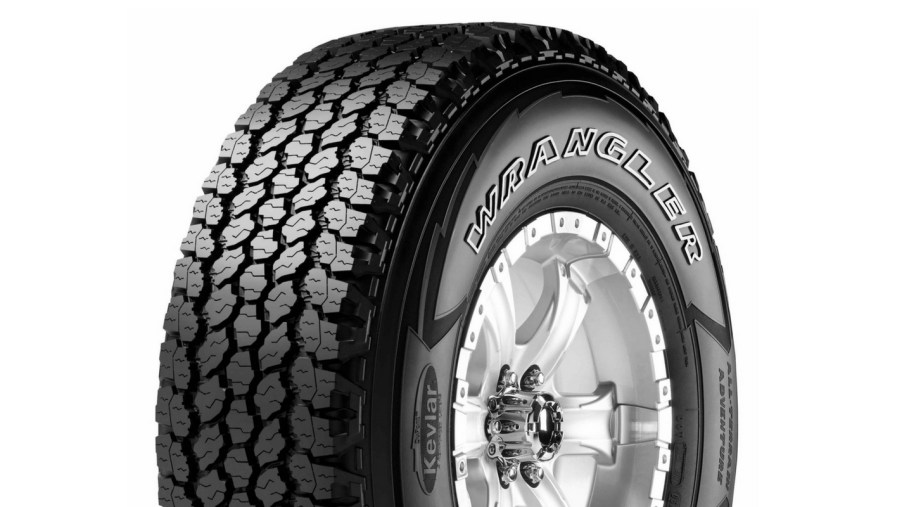A single Goodyear Wrangler tire with outlined white letters