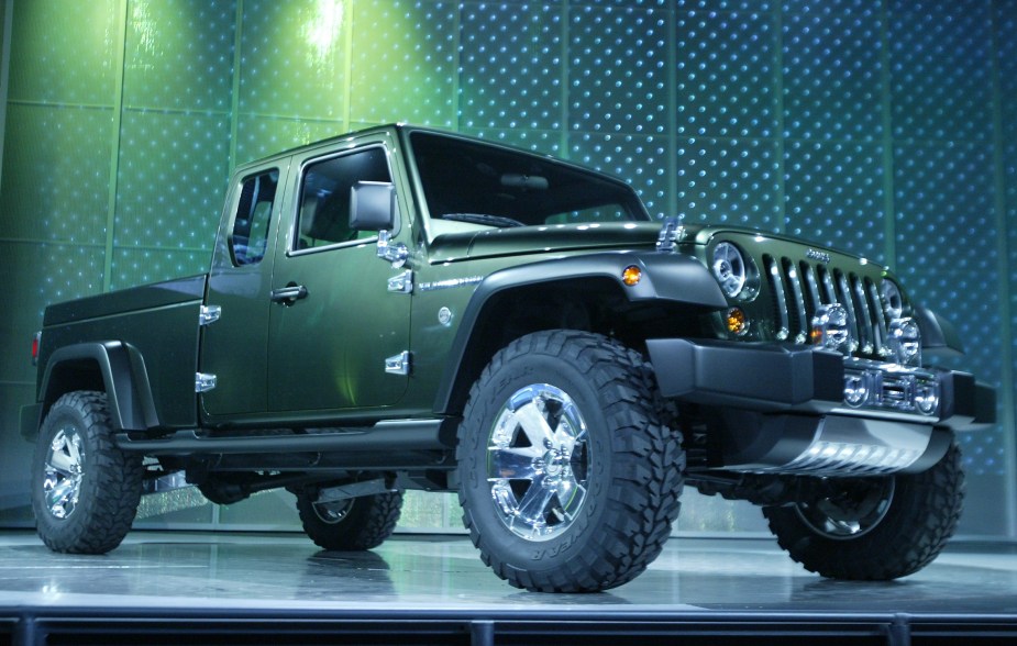 A green Jeep Gladiator concept truck on dispaly