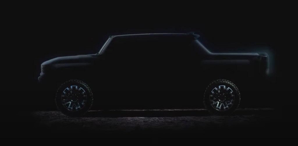 The outline of a GMC Hummer all-electric pickup is lit up on a black background.