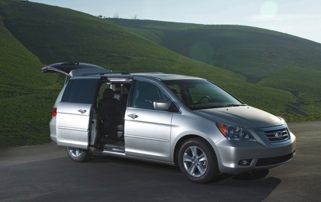 A silver 2008 Honda Odyssey with its passenger-side sliding door open