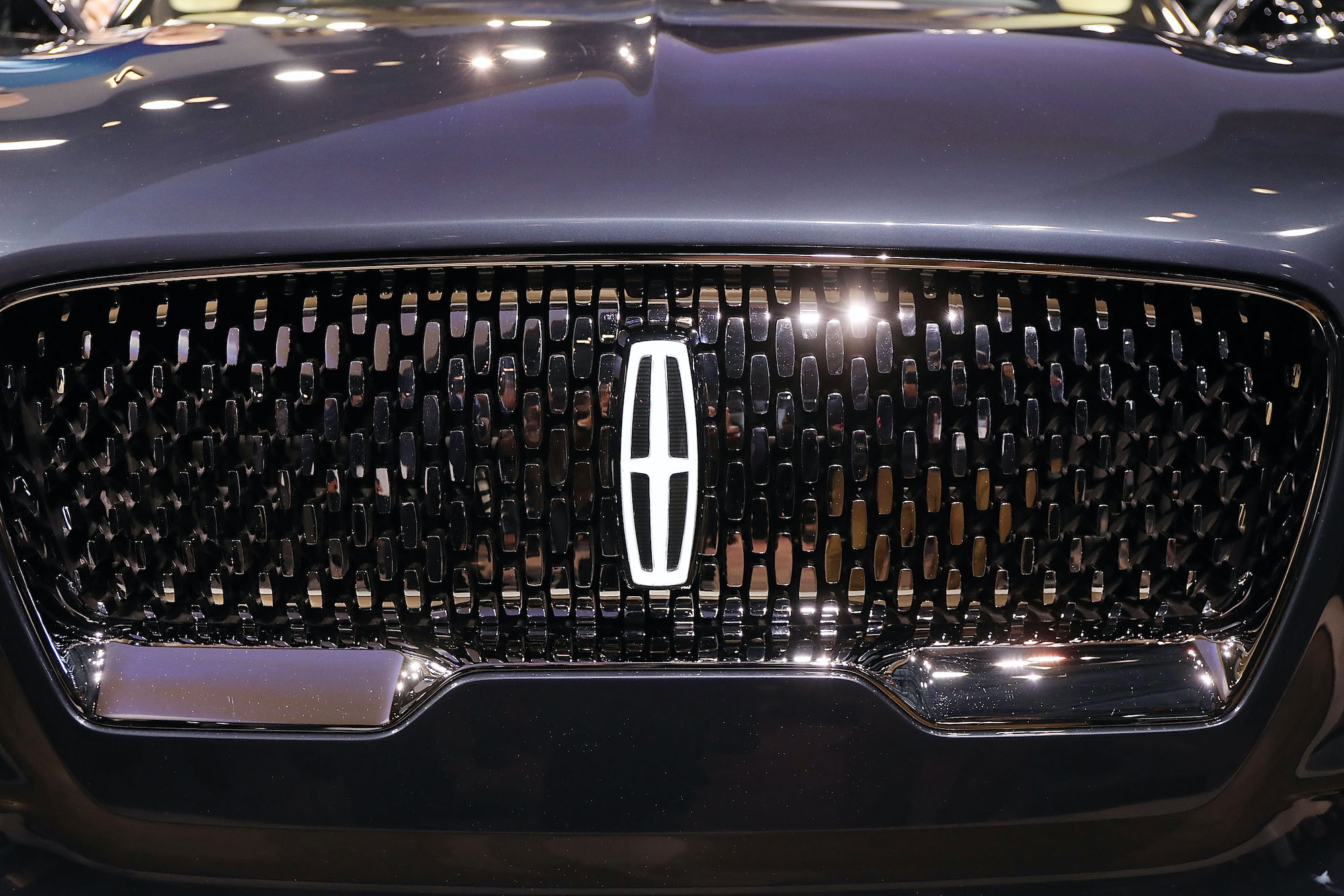 The front grill of the new 2019 Lincoln Aviator SUV, Lincoln's first plug-in hybrid vehicle, is displayed at the New York International Auto Show