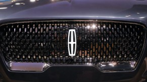 The front grill of the new 2019 Lincoln Aviator SUV, Lincoln's first plug-in hybrid vehicle, is displayed at the New York International Auto Show