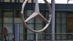 A Mercedes-Benz three-pointed star emblem is pictured on January 29, 2020 outside a factory
