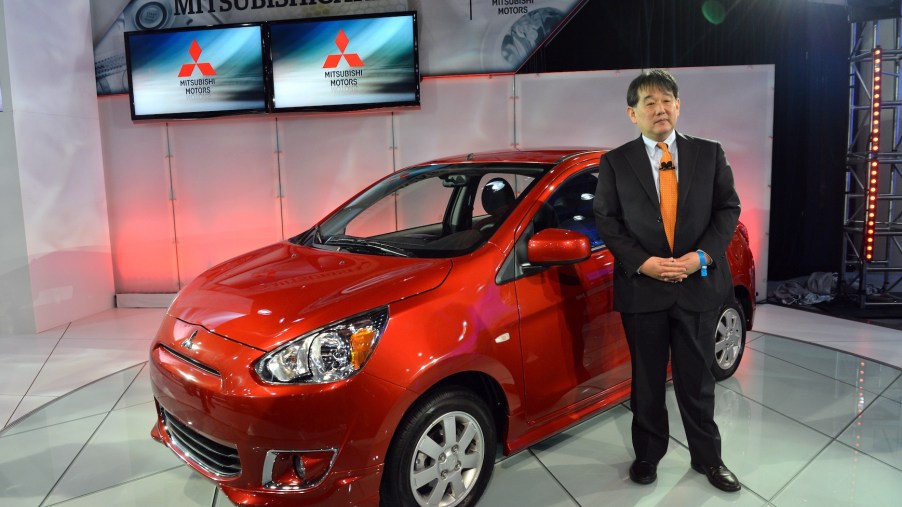 Yoichi Yokozawa in front of the 2014 Mistubishi Mirage, unveiled during the second press preview day at the New York International Automobile Show