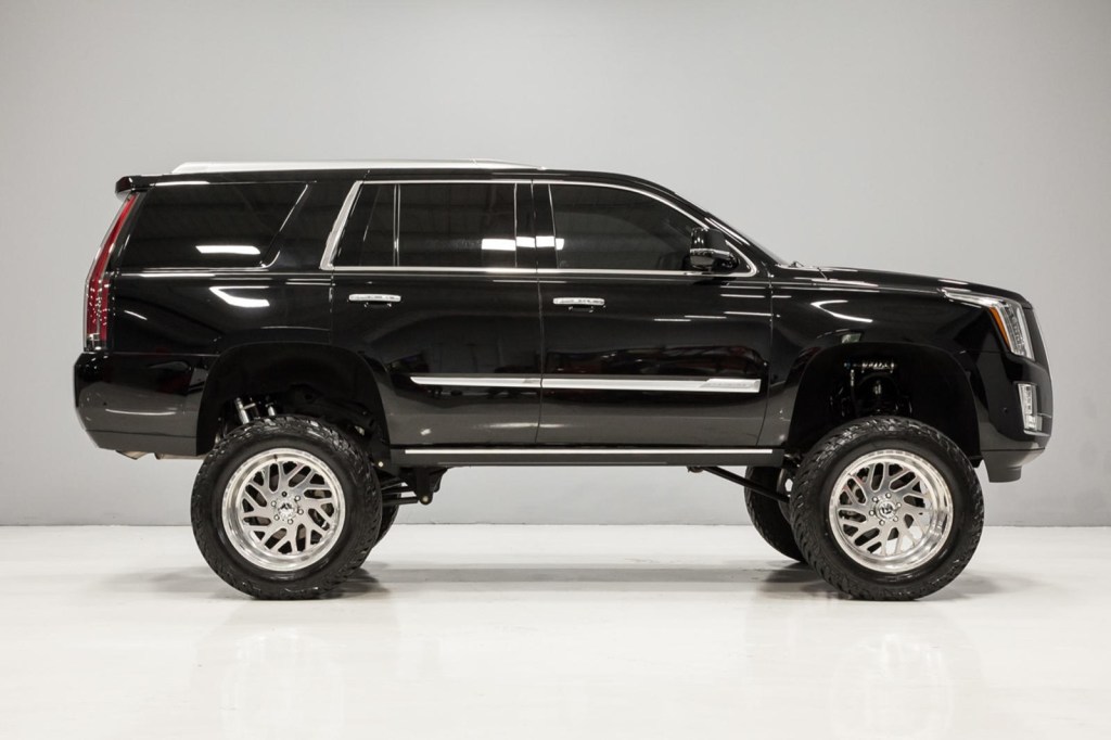 side view of black lifted 2017 Cadillac Escalade