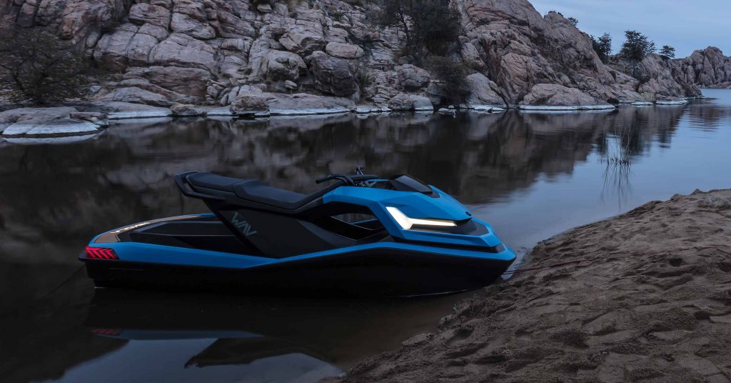 A blue Nikola jetski is on shore.