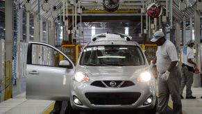 Cars get the final inspection in the assembly line of the March and Versa models at Nissan's Industrial Complex