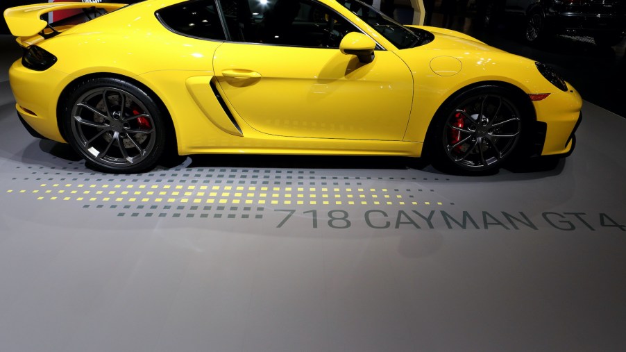 A yellow Porsche 718 Cayman GT4 on display at the Annual Chicago Auto Show
