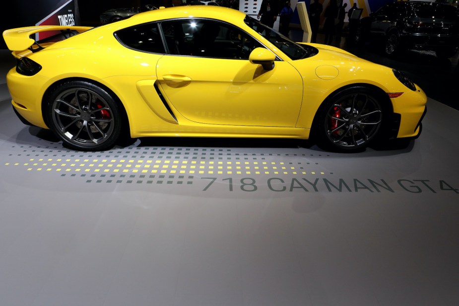 A yellow Porsche 718 Cayman GT4 on display at the Annual Chicago Auto Show
