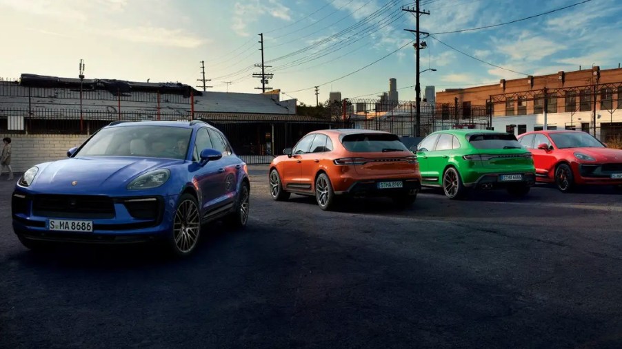 Multiple Porsche Macan small luxury SUVs are parked.