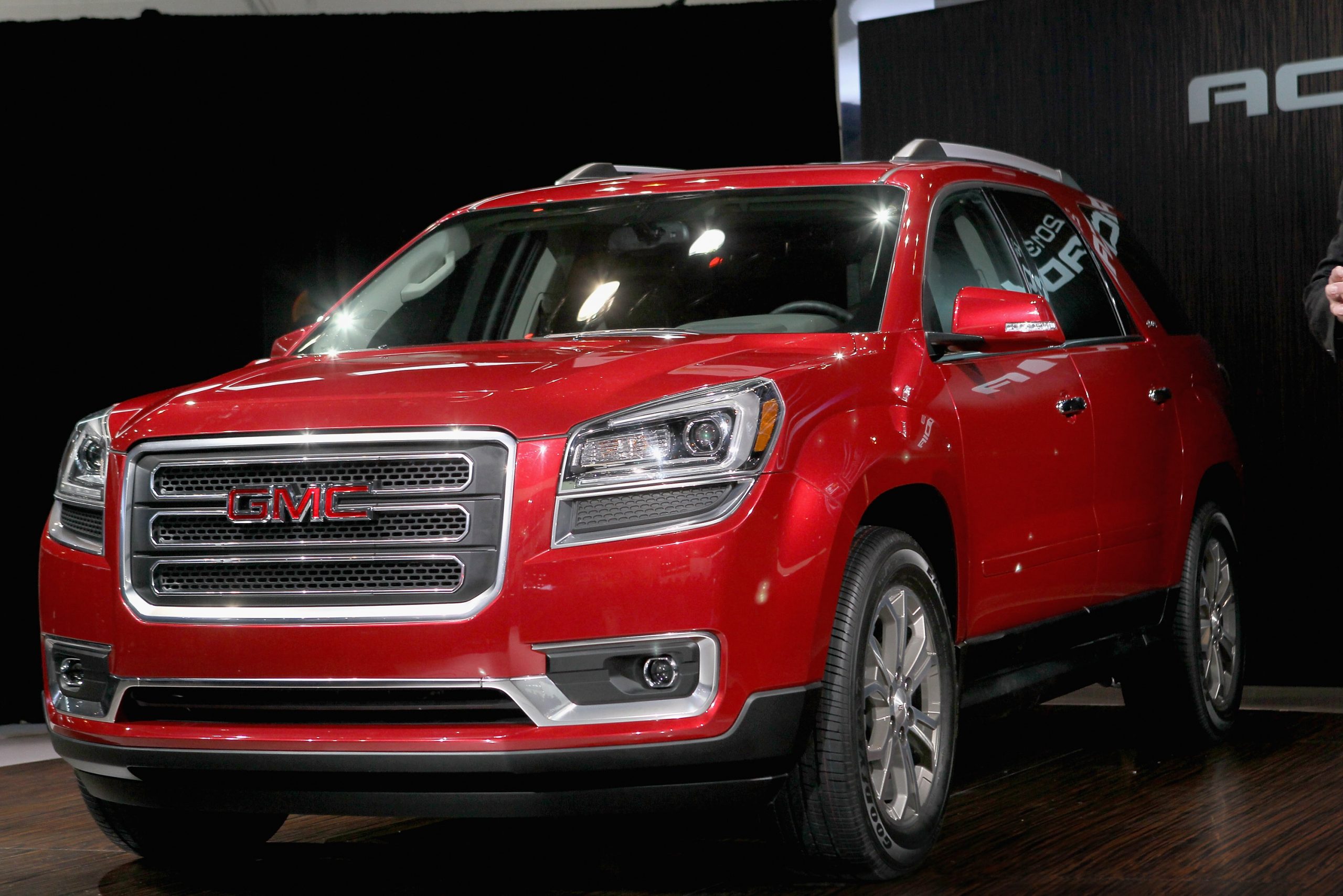 A red GMC Acadia on display