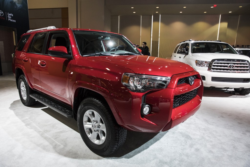 A red Toyota 4Runner on display at an auto show