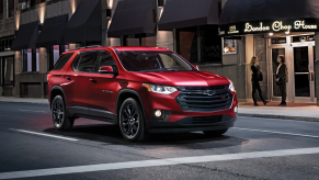 2020 Chevy Traverse driving on city street at night