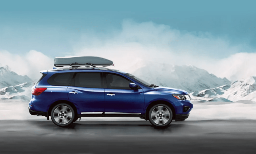 2020 Nissan Pathfinder driving down snowy road