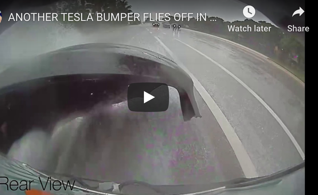 screen shot of tesla video with rear bumper flying off of it from buildup of water