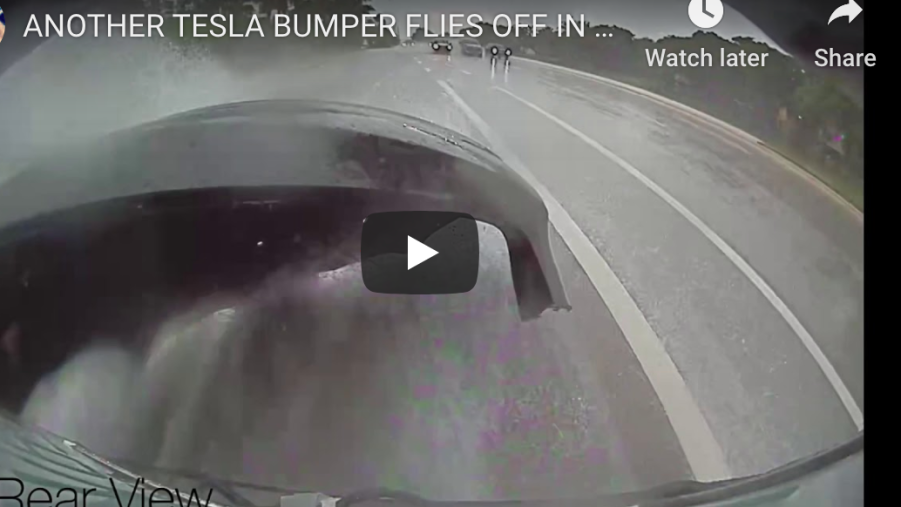 screen shot of tesla video with rear bumper flying off of it from buildup of water
