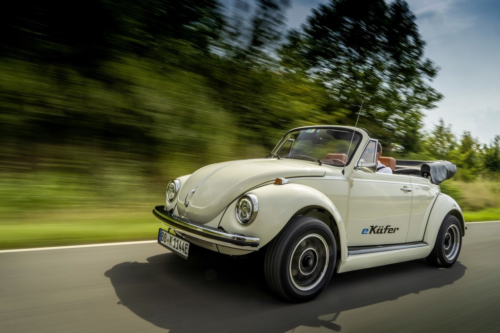 A white classic Volkswagen Beetle convertible converted to electric power
