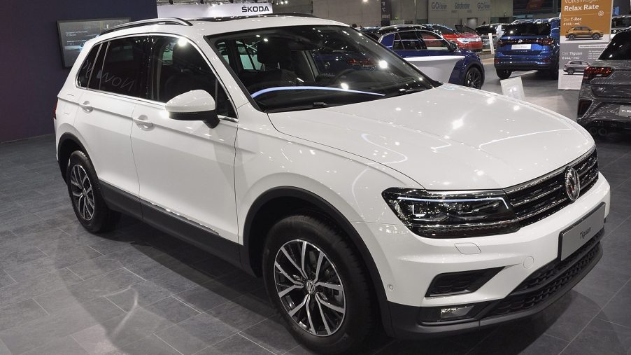A white Volkswagen Tiguan on display at an auto show