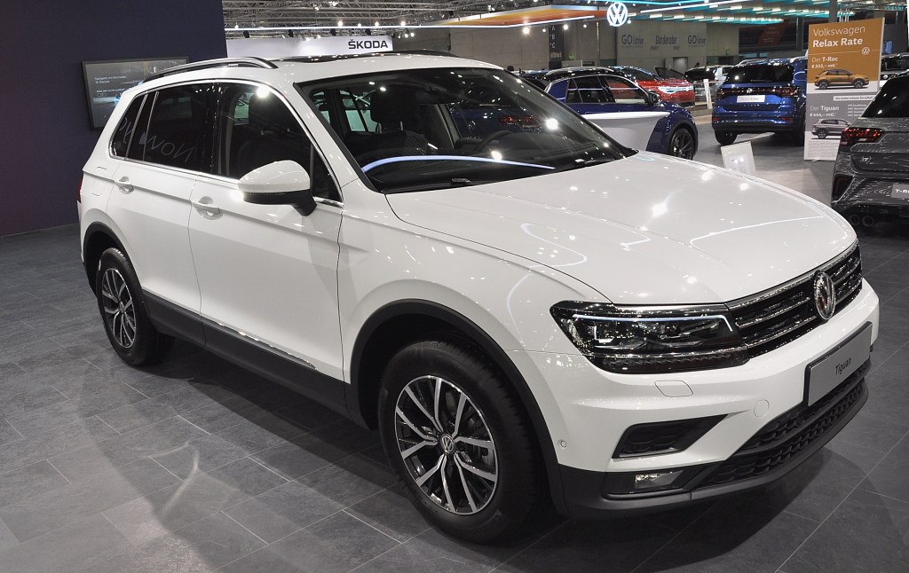 A white Volkswagen Tiguan on display at an auto show