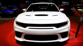 A white 2020 Dodge Charger on display at an auto show