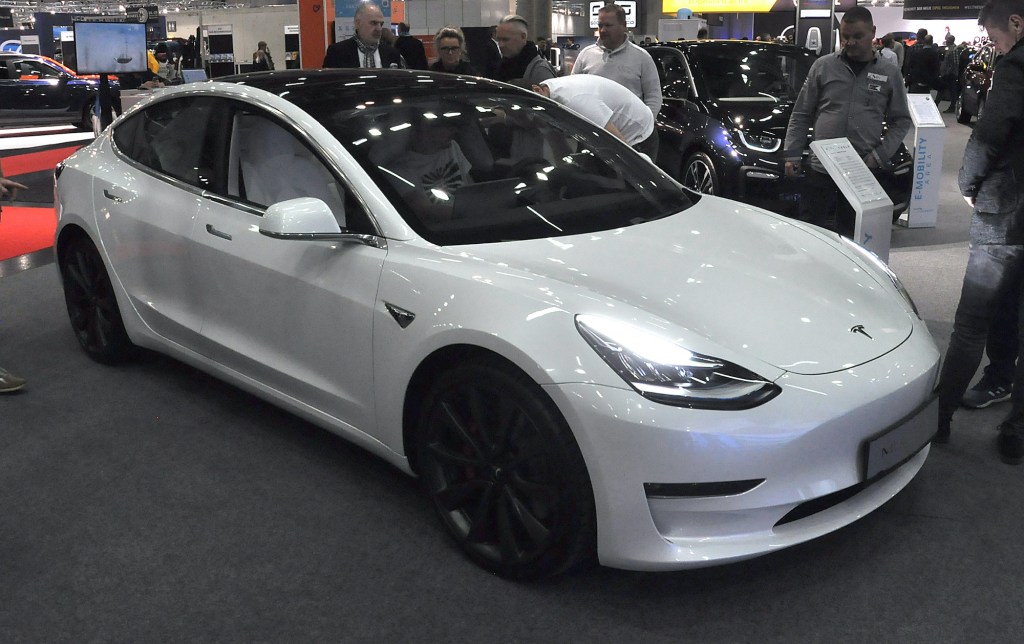 A white Tesla Model 3 is seen during the Vienna Car Show press preview