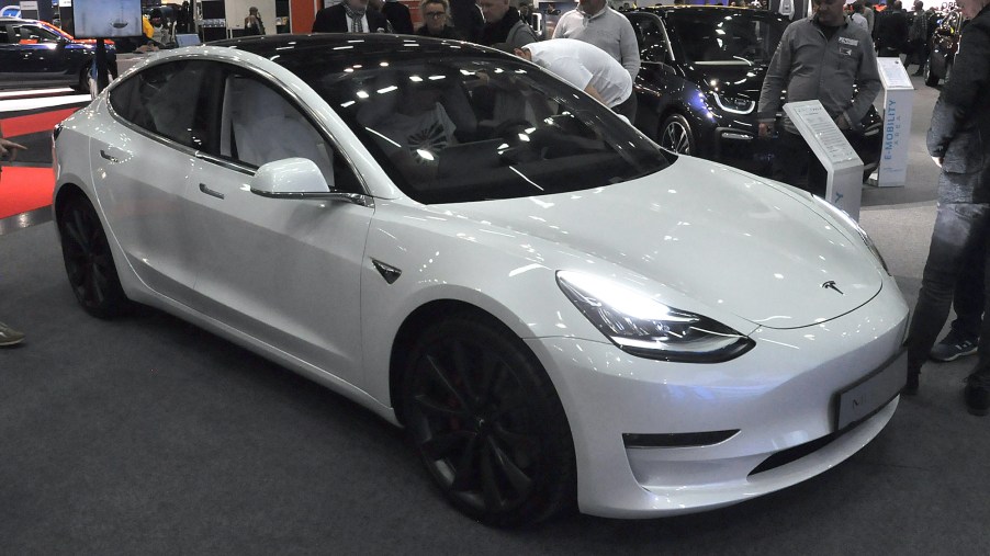 A white Tesla Model 3 is seen during the Vienna Car Show press preview