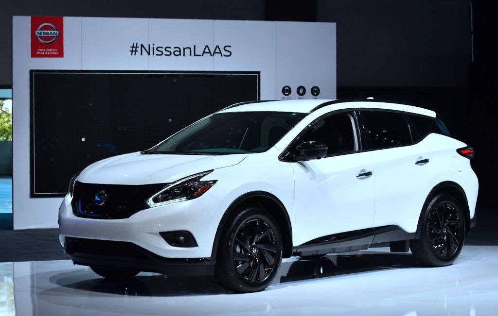 A white Nissan Murano on display at an auto show