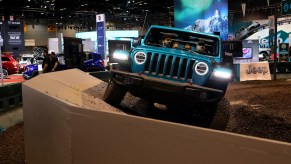 A 2020 Jeep Wrangler Rubicon makes its way through the 'Jeep Experience Articulation' exhibition at the 112th Annual Chicago Auto Show