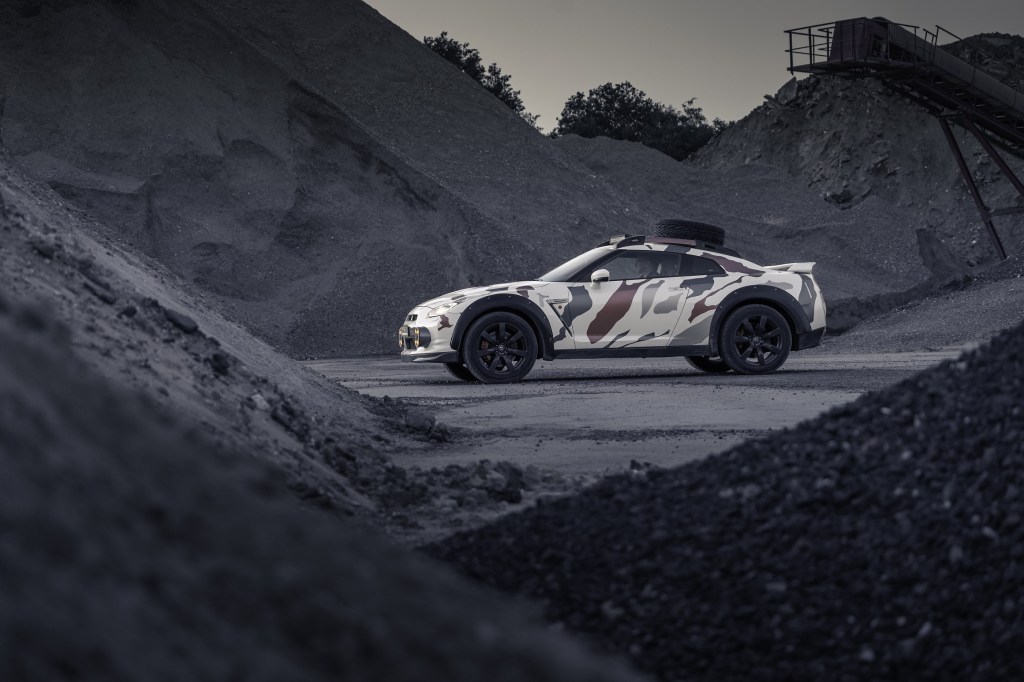 The camo-wrapped R35 Nissan GT-R modified by Classic Youngtimers Consultancy parked in a quarry