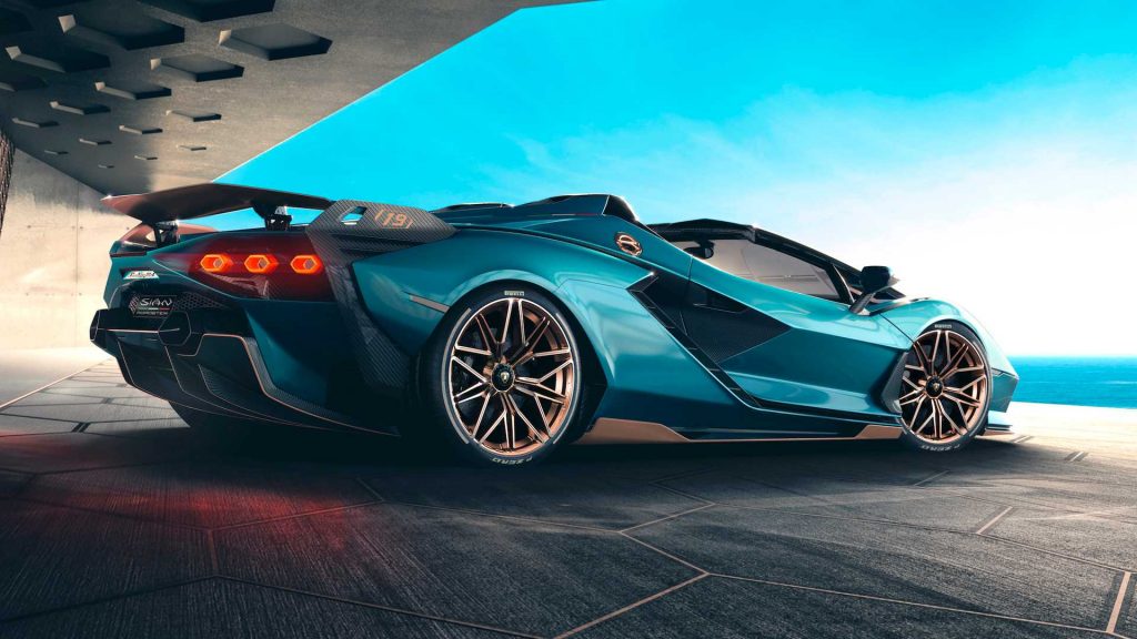 rear 3/4 view of turquoise lamborghini roadster