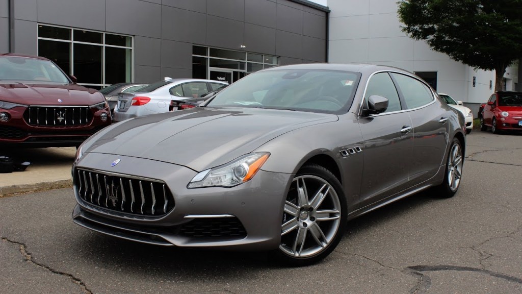 A gray 2017 Maserati Quattroporte parked at a dealership.