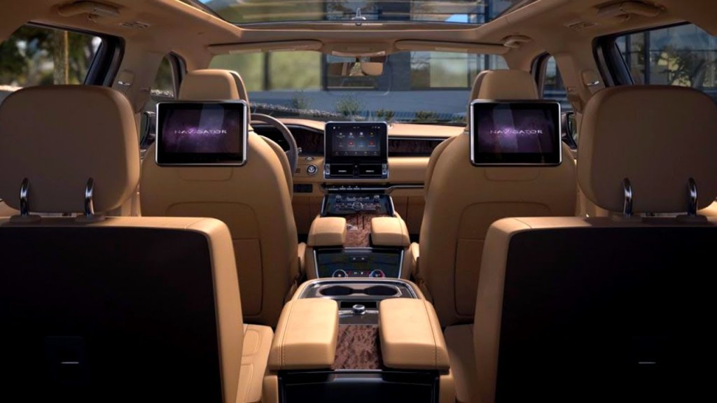 The inside of the 2020 Lincoln Navigator that's been upgraded with a rear-seat entertainment system and much more room than a g-wagon