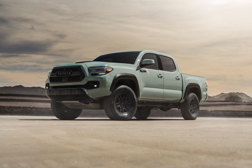 a 2021 toyota tacoma trd pro showing of its aggressive stance in the desert