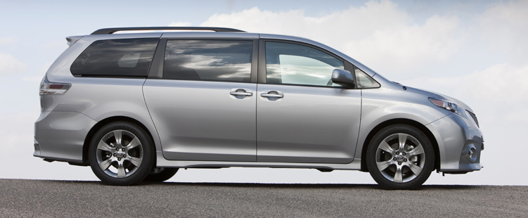 side view of a silver 2011 Toyota Sienna