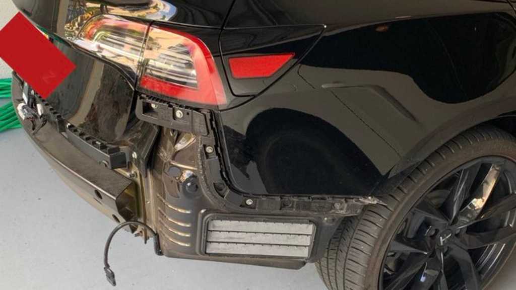 close up of Tesla rear after bumper flew off from water buildup