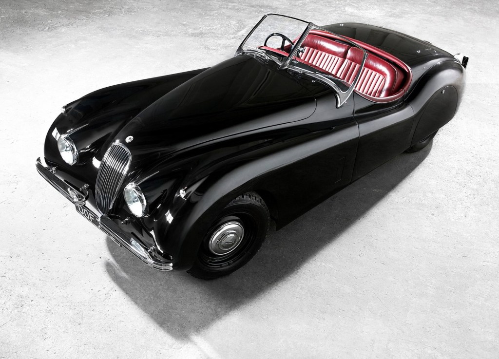 A black 1948 Jaguar XK120 without its roof