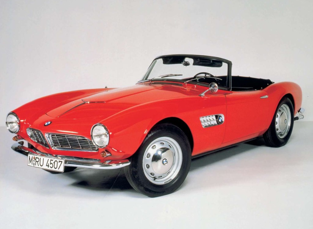 A red 1955 BMW 507 roadster with its top down