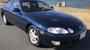 A blue Lexus SC300 coupe at the waterfront