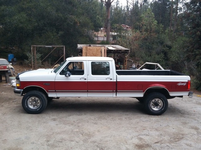 A white and red heavy duty Ford F-350 pickup truck 1996 model year 