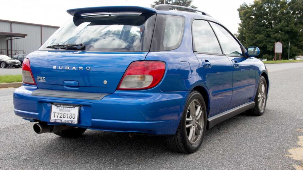 an iconic blue used Subaru Impreza WRX wagon rear view