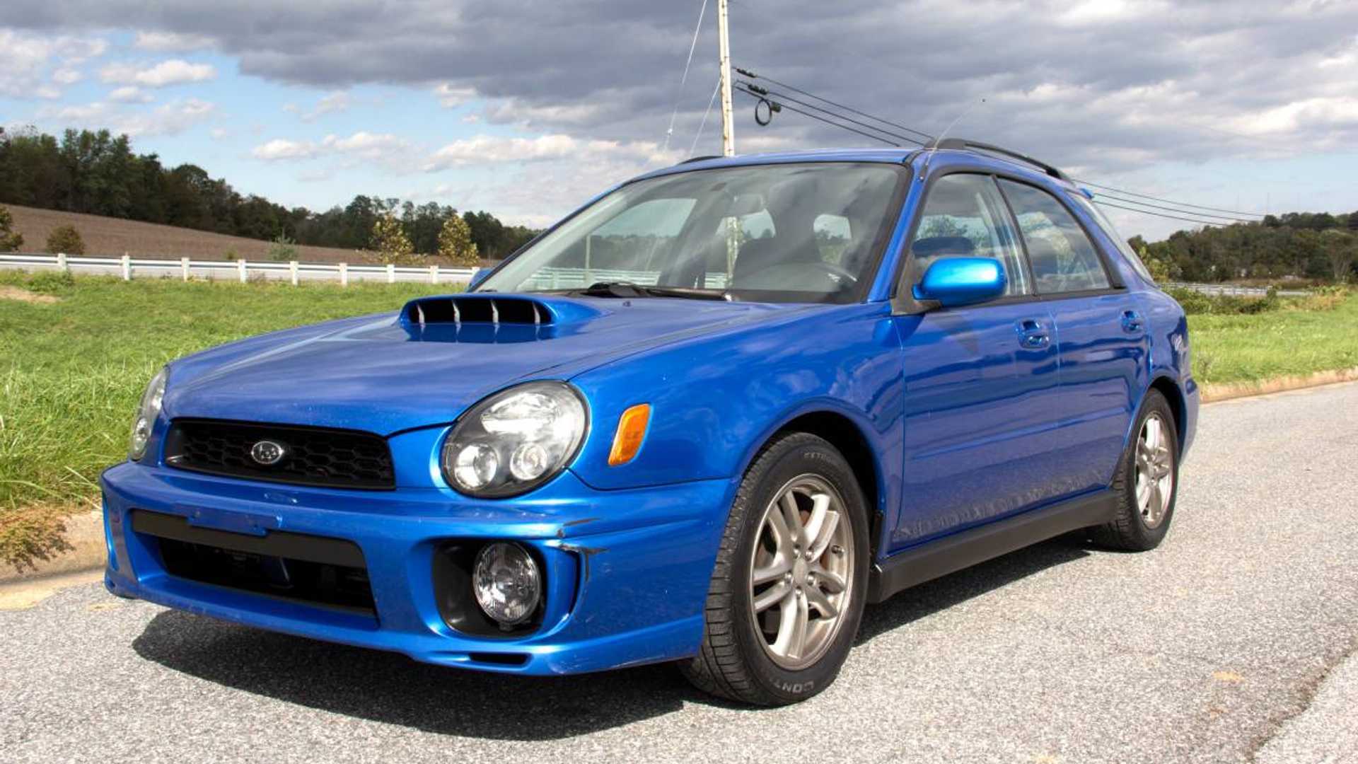 a blue used Subaru Impreza WRX wagon