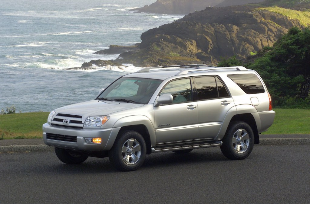 2004 Toyota 4Runner parked by the ocean and overlooking mountains