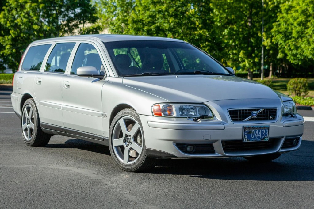 2004 Volvo V70 wagon driving on a treelined road