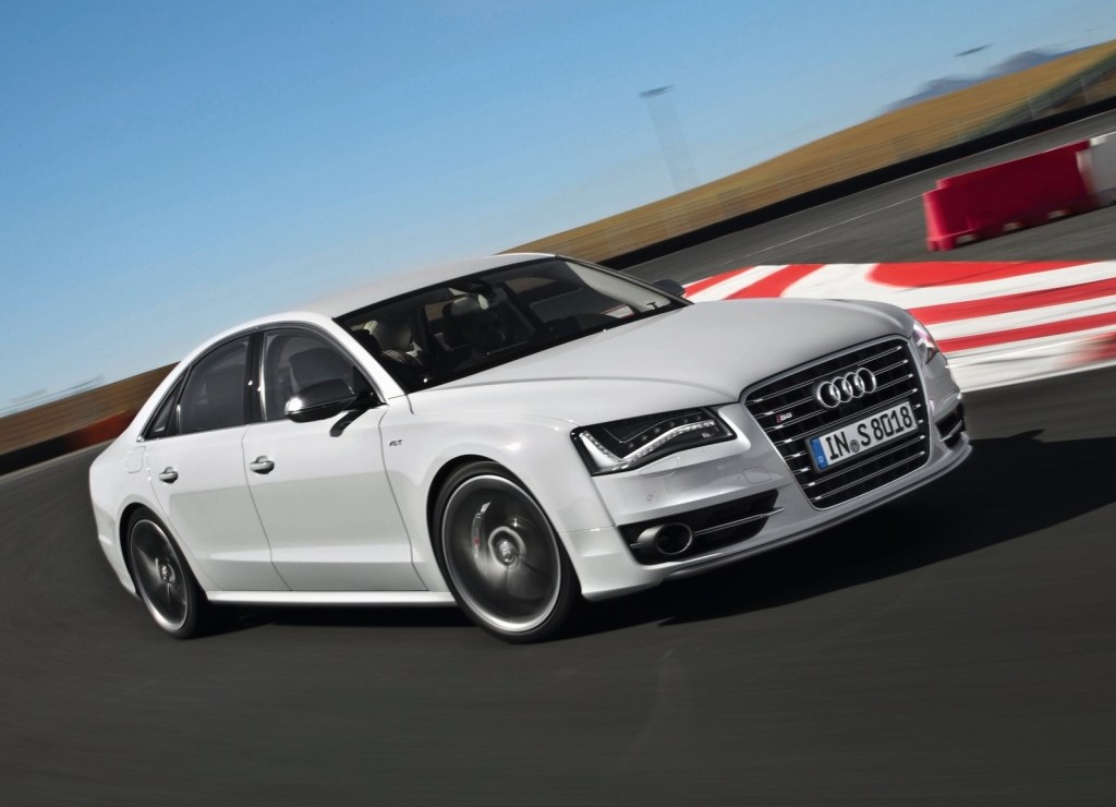 A white 2013 Audi S8 on a racetrack