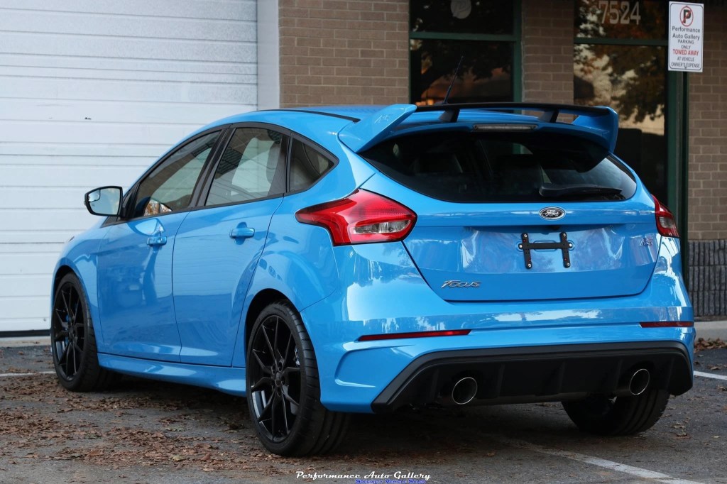 The rear of a blue 2016 Ford Focus RS