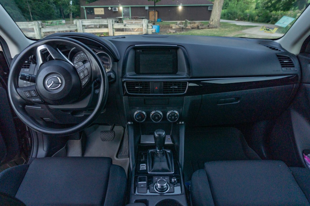 The black front interior of a 2016 Mazda CX-5 Sport